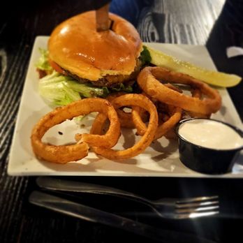Flowing Tide Pub 10 - Just a regular, yummy looking cheeseburger with onion rings. This was huge and looked so juicy! - Sports Bars Near Me - Sparks, Nevada