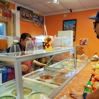 Elotes Gomez - a man and a woman ordering food - Specialty Food Near Me - Aurora, Illinois