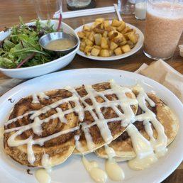 Cinnamon roll pancakes, breakfast potatoes, mixed greens and tropical bliss smoothie Cinnamon roll pancakes, breakfast potatoes, mixed greens and tropical bliss smoothie