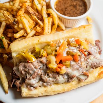 Chop Shop - a sandwich and french fries on a plate - Bars Near Me - Chicago, Illinois