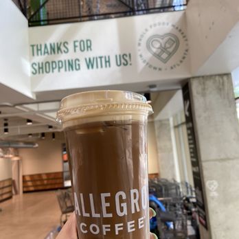 Capital Commons - a hand holding a cup of coffee - Coffee & Tea Near Me - Atlanta, Georgia