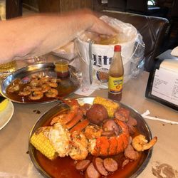 Red Hook Cajun Seafood & Bar - Our platter with corn, excellent, and potatoes, lobster crab legs, shrimp