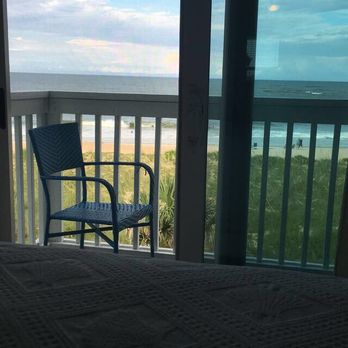 The Saint Augustine Beach House - sitting on the bed and you can see the ocean! my favorite part :) - Hotels Near Me - Saint Augustine, Florida