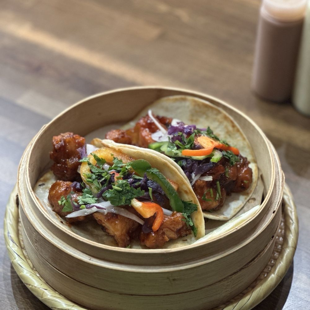 Dragon Casa - Orange Chicken Tacos served on Flour Tortilla's Also served with Taqueria Style Green and Red Salsa (10 out of 10 ) - Asian Fusion Near Me - Dallas, Texas Dragon Casa - Orange Chicken Tacos served on Flour Tortilla's Also served with Taqueria Style Green and Red Salsa (10 out of 10 ) - Asian Fusion Near Me - Dallas, Texas