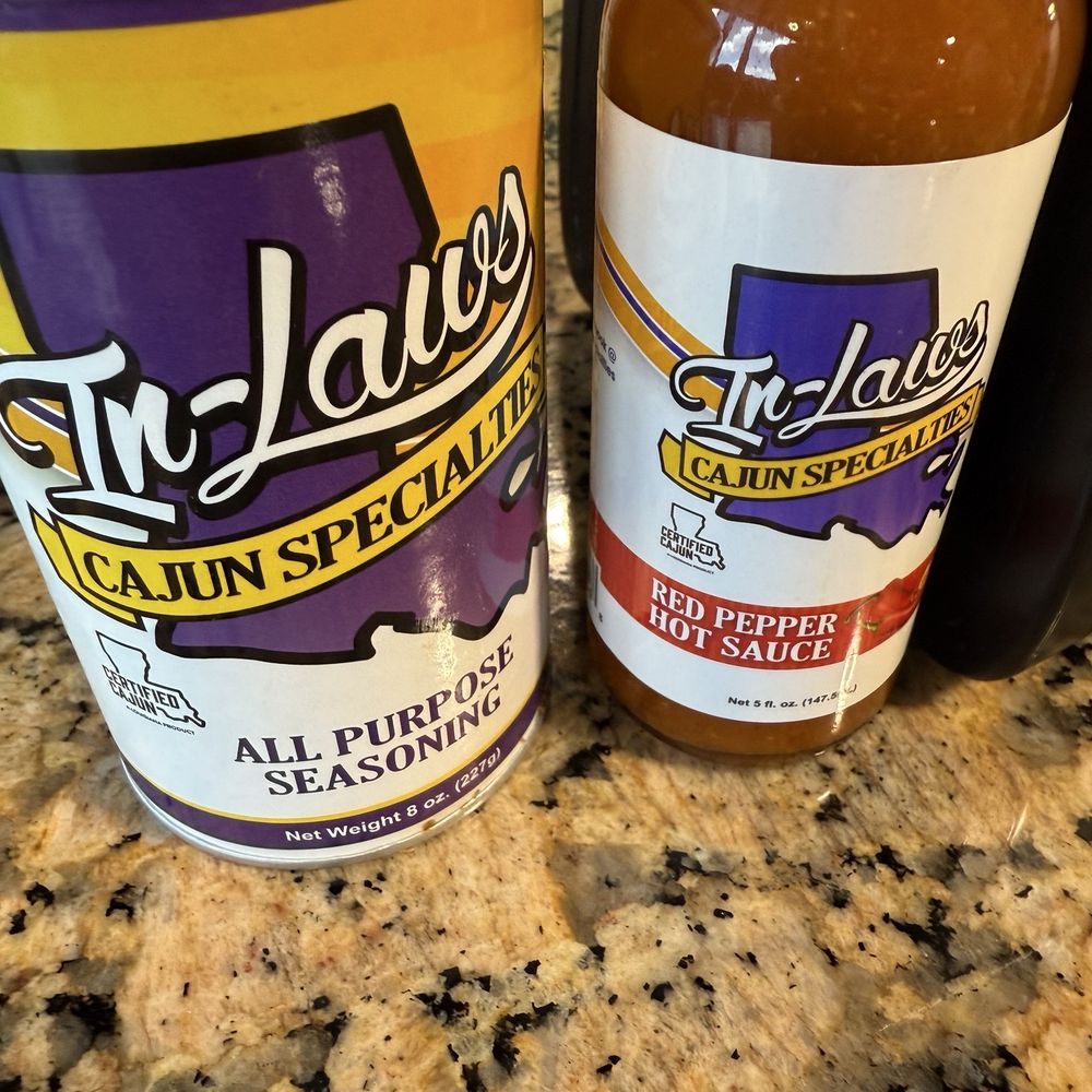 In Laws - Seasoning and hot sauce on table for dine in (also available to purchase) - Cajun/Creole Near Me - Iowa, Louisiana