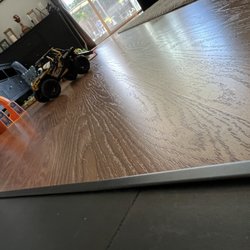 Elite Pro Flooring - T- molding not Installed properly.