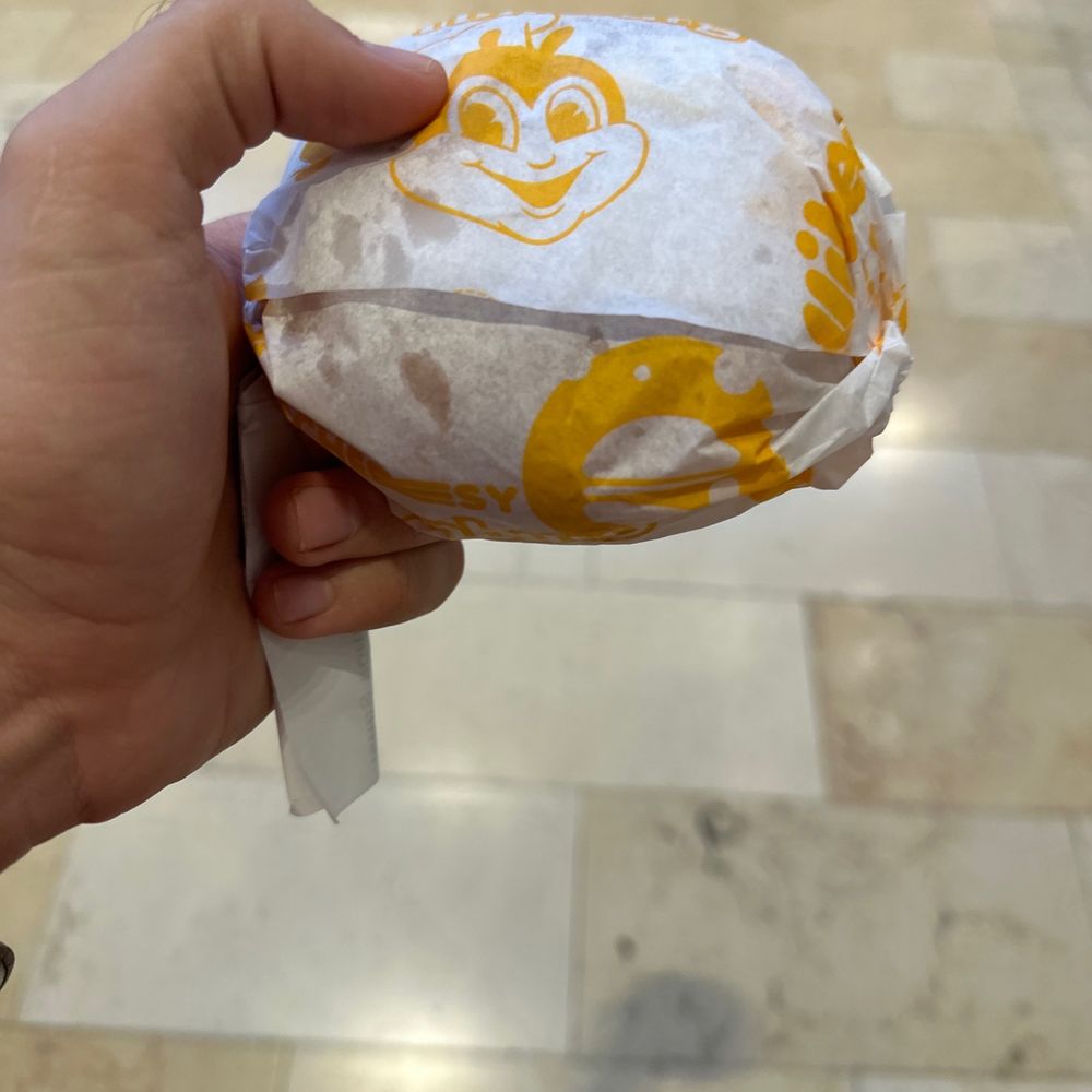 Jollibee - a person holding a sandwich in their hand - Chicken Shop Near Me - Mississauga, Alberta Jollibee - a person holding a sandwich in their hand - Chicken Shop Near Me - Mississauga, Alberta