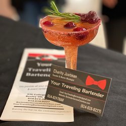 Your Traveling Bartender - Specialty drink crafted by Charity. She provided the glassware and prepared most of the fresh juice/garnish the night before.