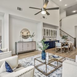 Staging the Nest - Vacant Staging - Home Builder Inventory Home - Living Room with blue accents