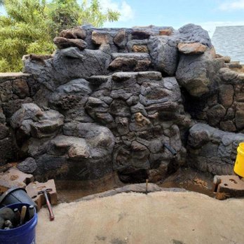 trueworkshawaii - a rock wall with a bucket of tools - Landscaping Near Me trueworkshawaii - a rock wall with a bucket of tools - Landscaping Near Me