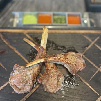 Off The Hook Churrascaria - a steak on a chopping board - Brazilian Near Me - Islamorada, Florida