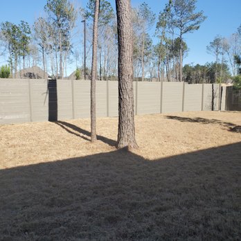 Texas Wood Artisans - a fenced yard with a tree in the foreground - General Contractors Near Me Texas Wood Artisans - a fenced yard with a tree in the foreground - General Contractors Near Me