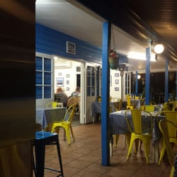 Kafenio - Dining on the deck while greek men play backgammon inside.