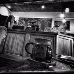  black and white photo of a bar