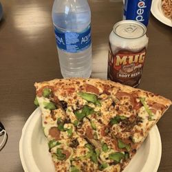 Kenny’s Pizza - Works pizza slice.