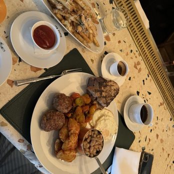 Saint Theo's - a plate of food on a table - Italian Near Me - New York, New York Saint Theo's - a plate of food on a table - Italian Near Me - New York, New York