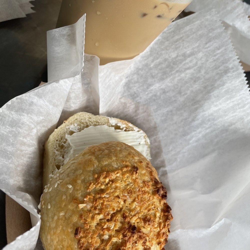 Fionas Coffee Bar And Bakery - Iced honey lavender latte with an onion bagel and cream cheese - Bagels Near Me - Willoughby, Ohio