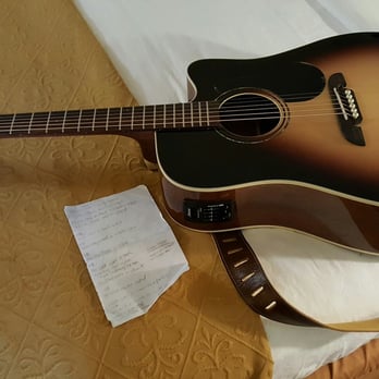 Quality Inn & Suites - Brand new guitar on fresh sheets and comforter at the Quality Inn - Hotels Near Me - Mobile, Alabama