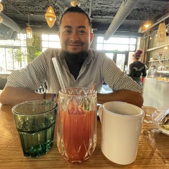 Gallery Bistro & Bar - My friend enjoying all the drinks! Water, a Bloody Mary and coffee. - Bars Near Me - Indianapolis, Indiana Gallery Bistro & Bar - My friend enjoying all the drinks! Water, a Bloody Mary and coffee. - Bars Near Me - Indianapolis, Indiana