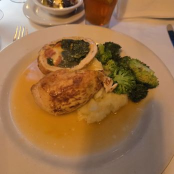 Assaggio Ristorante - Stuffed chicken breast with roasted red peppers and spinach with mozzarella cheese. Mash potatoes and broccoli with a demi sauce. - Italian Near Me - Seattle, Washington