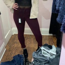 Maroon pants, lingerie onesie and fur jacket