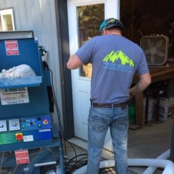 Koberstein Insulation - Owner Ryan Koberstein hard at work with the cellulose machine