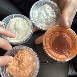 Papous Pita - Garlic Aoili(top left) Tzatziki (top right) Spicy Feta Sauce (bottom left) Hot Sauce (bottom right)