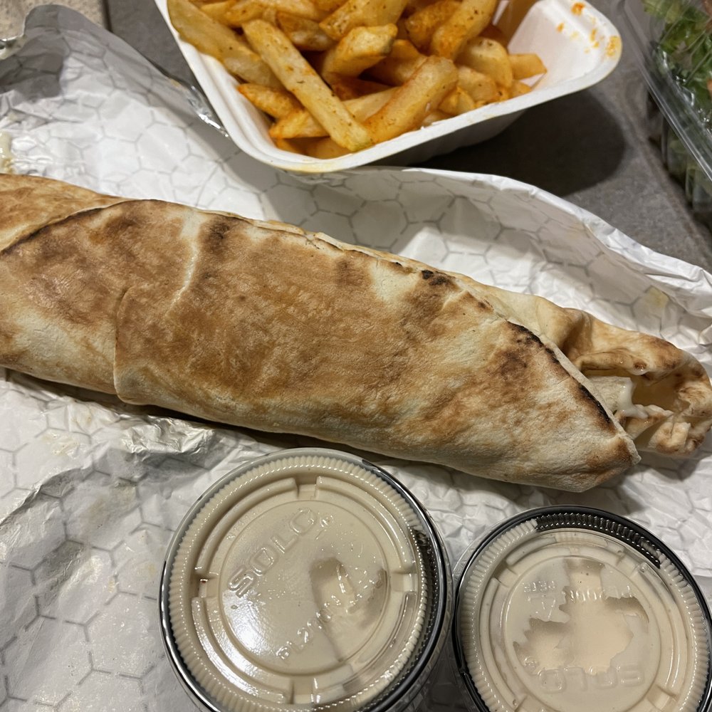 Master Falafel - Classic Falafel Wrap with garlic sauce, and a side order of fries - Middle Eastern Near Me - Rochester, New York Master Falafel - Classic Falafel Wrap with garlic sauce, and a side order of fries - Middle Eastern Near Me - Rochester, New York