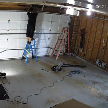Top Choice Garage Doors - Fermy removed the old torsion springs (on the garage floor) and replaced with new springs. - Garage Door Services Near Me