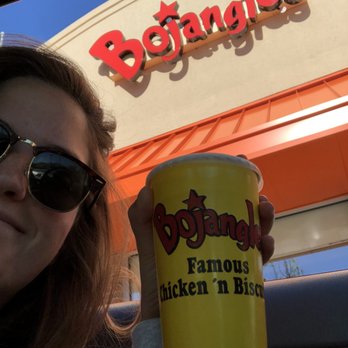 Bojangles - Girl holding sweet tea cup from car outside of a bojangles - Fast Food Near Me - Duluth, Georgia