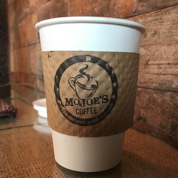 MoJoe's Coffee - a coffee cup on a table - Coffee & Tea Near Me - Neosho, Missouri