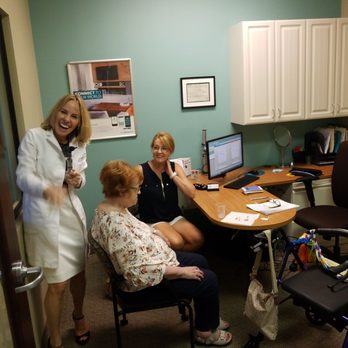 Miracle-Ear Hearing Aid Center - Toni fitting and adjusting hearing aids for patients. - Hearing Aid Providers Near Me - Escondido, California Miracle-Ear Hearing Aid Center - Toni fitting and adjusting hearing aids for patients. - Hearing Aid Providers Near Me - Escondido, California
