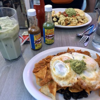 Millie's Cafe - Pasadena - Chilaquiles with over-medium eggs and a matcha iced latte. - Breakfast & Brunch Near Me - Pasadena, California