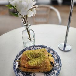 maman - Pistachio chocolate croissant with some kind of sweet filling