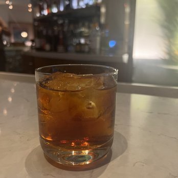 Stir - a drink in a glass on a counter - Lounges Near Me - Lake Buena Vista, Florida Stir - a drink in a glass on a counter - Lounges Near Me - Lake Buena Vista, Florida