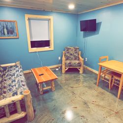 Raven Acres Cabins And RV Resort - A living area in one of our one bedroom cabins.