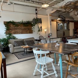 a table and chairs in a coffee shop