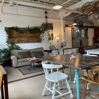Steelyard Coffee Co - a table and chairs in a coffee shop - Coffee Roasteries Near Me - Elkhart, Indiana