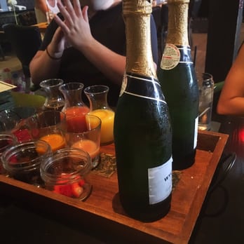 Rustic Root - Mimosa brunch! Two bottles of champagne and a variety of berries, juices, and puréed fruits. Great deal! - Cocktail Bars Near Me - San Diego, California Rustic Root - Mimosa brunch! Two bottles of champagne and a variety of berries, juices, and puréed fruits. Great deal! - Cocktail Bars Near Me - San Diego, California