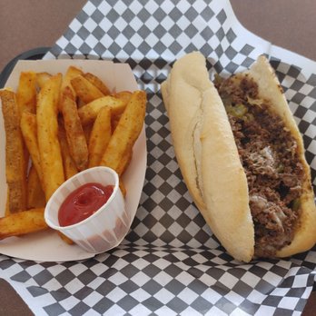 Philly Steaks - They Duke. Philly with pepper jack cheese and green chile. An order of fries. The fries are thick and nicely seasoned - Cheesesteaks Near Me - Albuquerque, New Mexico