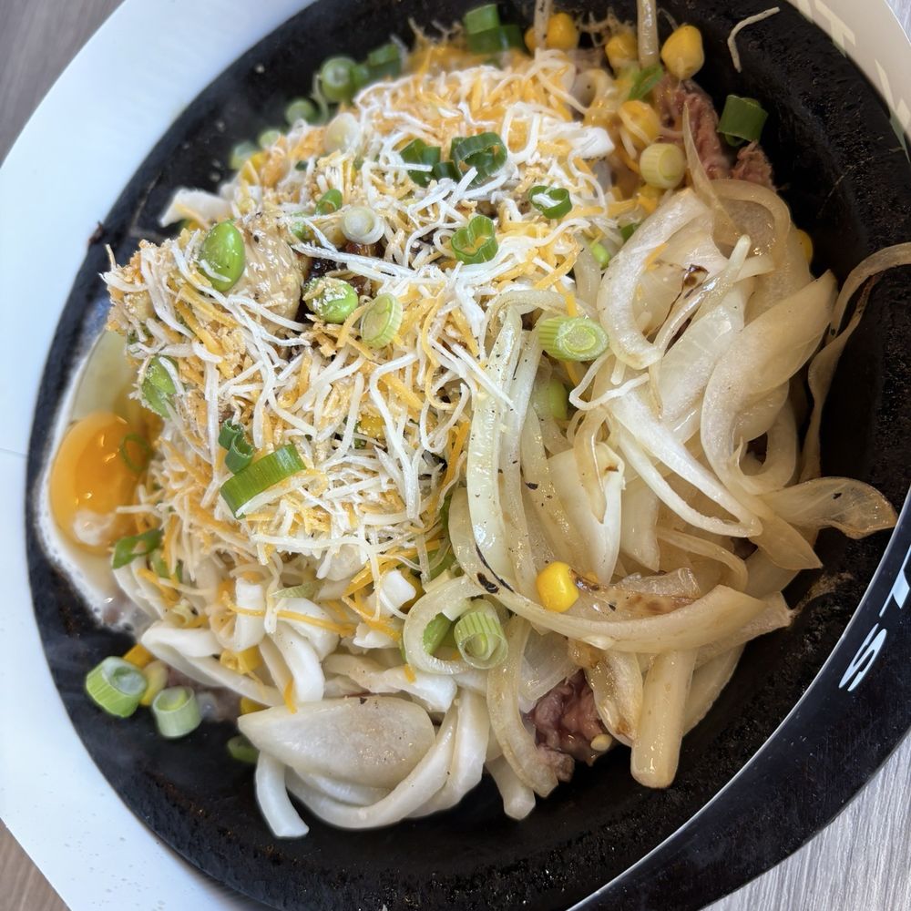 Tasty Pot - Beef sizzling plate with udon, onion, corn and a fried egg - Hot Pot Near Me - Temecula, California Tasty Pot - Beef sizzling plate with udon, onion, corn and a fried egg - Hot Pot Near Me - Temecula, California