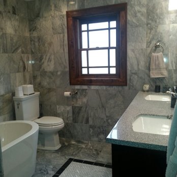 Brian Allendorfer Company - a bathroom with a tub, toilet, and sink - General Contractors Near Me - Chicago, Illinois