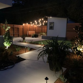 ARKLAND - a patio with lights - Landscaping Near Me ARKLAND - a patio with lights - Landscaping Near Me