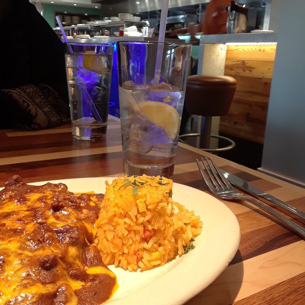 Mesero - Clearfork - The Tejanos- Two Cheese Enchiladas topped with Chili con Carne, Spanish rice and a Water w Lemon. - Mexican Near Me - Fort Worth, Texas Mesero - Clearfork - The Tejanos- Two Cheese Enchiladas topped with Chili con Carne, Spanish rice and a Water w Lemon. - Mexican Near Me - Fort Worth, Texas