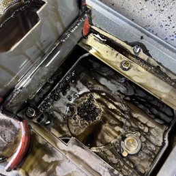 Metal from rod bearing(s) in oil pan, note excessive RTV on that was everywhere on every mating surface and gasket.