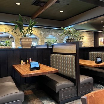 Cheddar's Scratch Kitchen - a table with a laptop on it - American Near Me - Terre Haute, Indiana