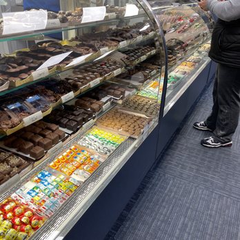 Krause's Homemade Candy - a man standing in front of a display case - Candy Stores Near Me - Fairview, New Jersey