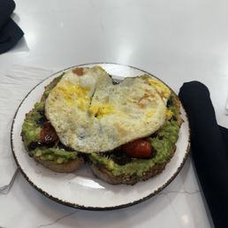 Avocado toast with egg over hard Avocado toast with egg over hard