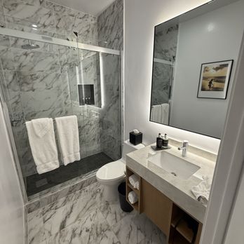 Elan Hotel - Bathroom. Nice shower. Toilet sits very low. Why do some hotels put these in instead of regular height? - Hotels Near Me - Los Angeles, California Elan Hotel - Bathroom. Nice shower. Toilet sits very low. Why do some hotels put these in instead of regular height? - Hotels Near Me - Los Angeles, California