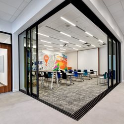 Realty Austin - Compass - Welcome to Realty Austin's North Office, enjoy a learning session in our modern and collaborative training room.